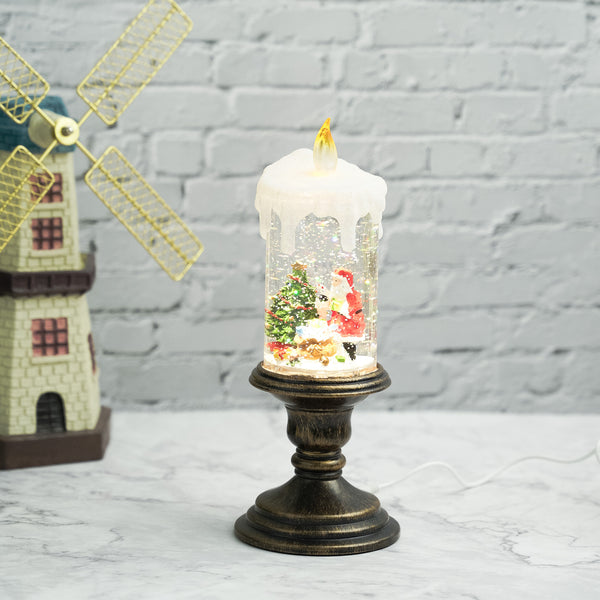 Holiday decorations, beautiful christmas snowglobe candle with lights and music, santa with reindeers by Accent Collection